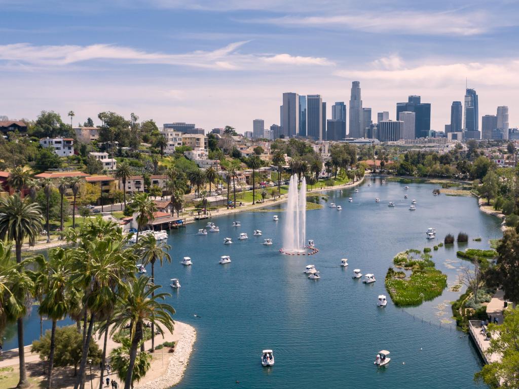 Los Angeles, USA with an aerial view of Echo Park in the foreground and downtown Los Angeles skyline in the background, taken on a sunny day.