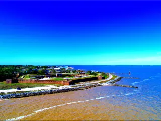 A panoramic view of a pentagon-shaped Fort Gaines along Mobile Bay in Dauphin Island, Alabama, USA, in fair weather