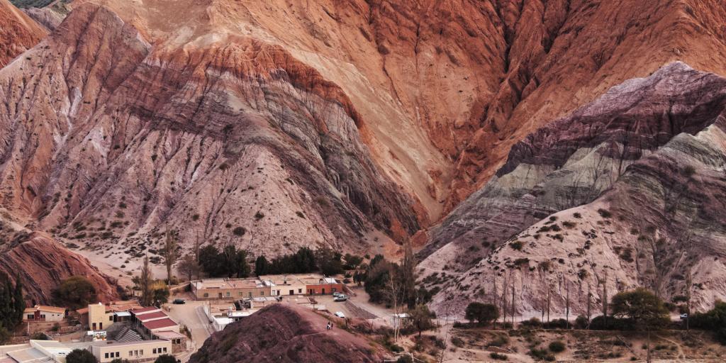 Elevated view of the Hill of Seven Colours in Purmamarca, Argentina, with different shades of reds and purples. 