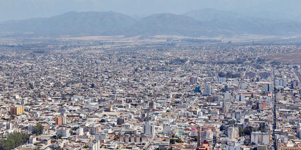 Aerial View of the Salta cityscape stretching into the distance with mountains in the background