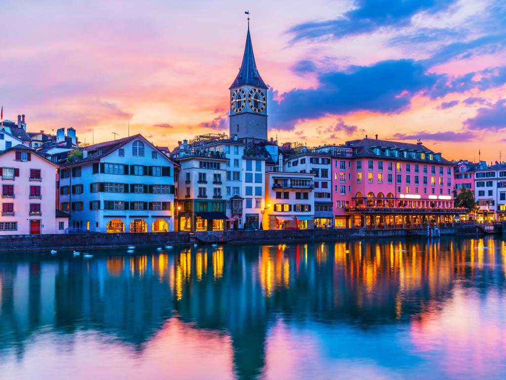 Scenic summer sunset view of the Old Town pier architecture and Limmat river embankment in Zurich, Swizerland