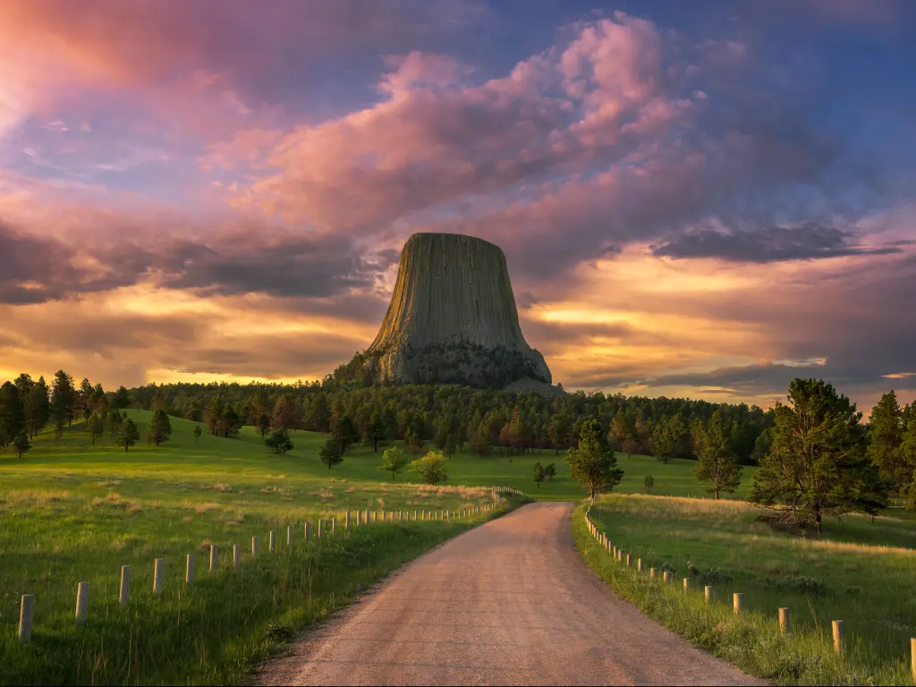 The Devils Tower rock formation in Wyoming at sunrise.