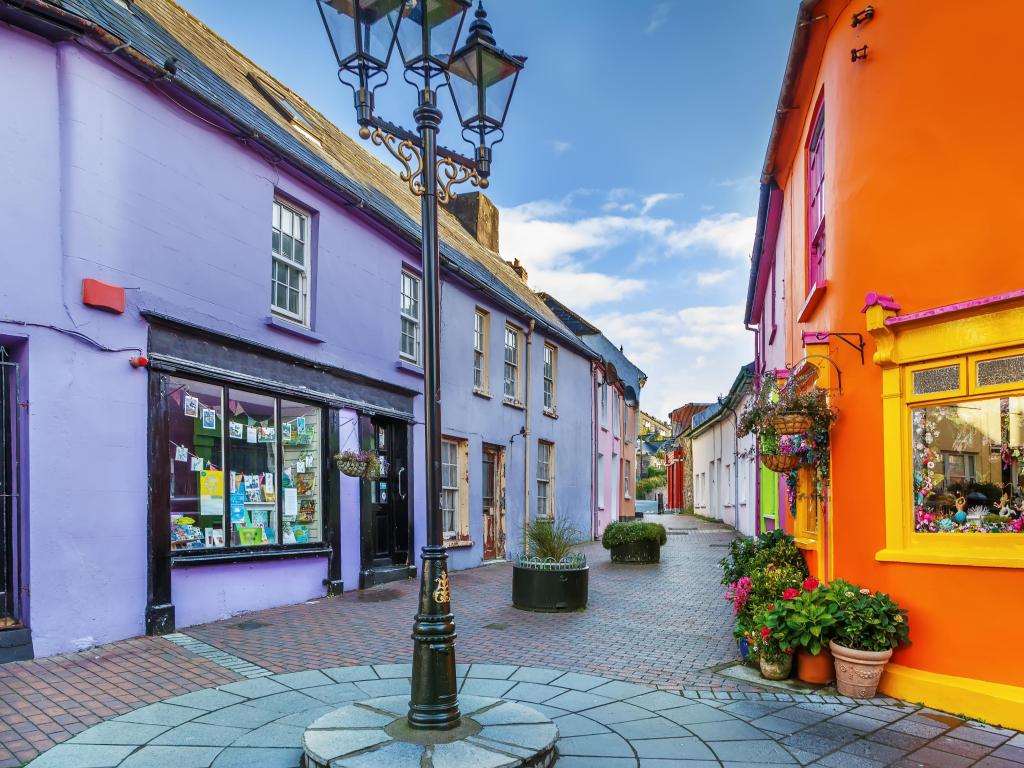 Kinsale, Ireland with a view of a street with bright coloured houses.