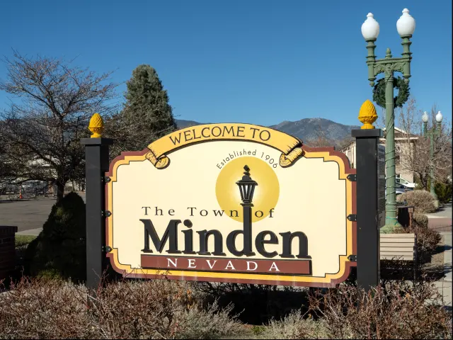 Close up shot of the Welcome to Minden Nevada road sign located on Highway 395, pictured on a sunny day