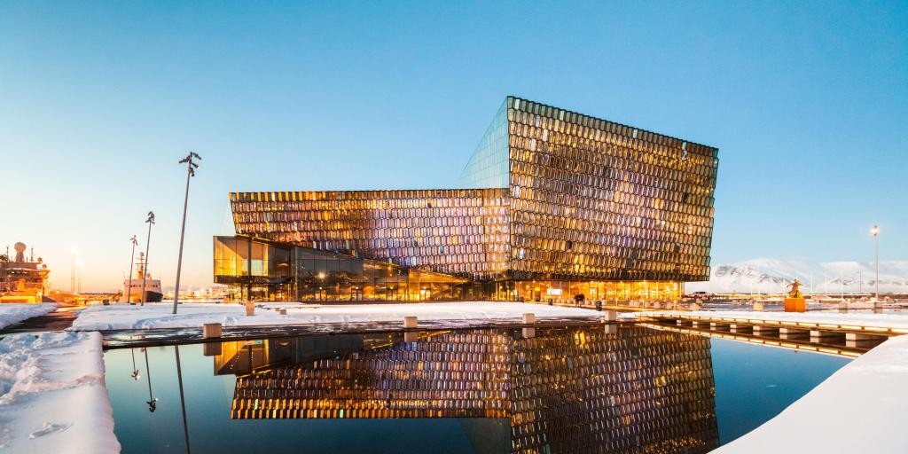 The Harpa Concert Hall, Reykjavik reflected on the water in the early evening  
