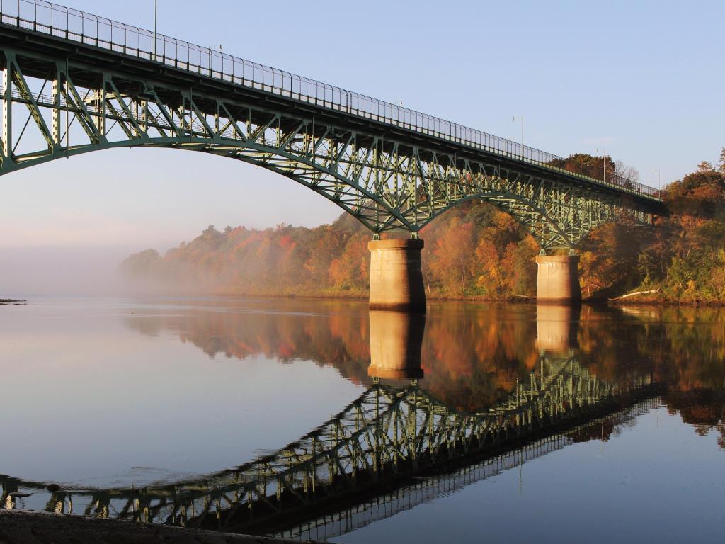 Kennebec River, Rail Trail. Photo taken during fall and depicts Kennebec Memorial Bridge, Augusta, Maine, USA