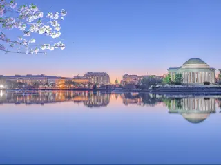 Washington DC Memorial, USA with the landmarks in the background reflecting in the water in the foreground taken at early evening. 
