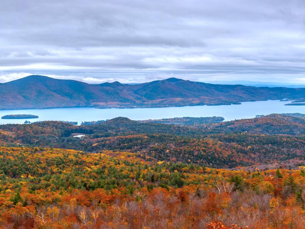 Panoramic view of Sleeping Beauty Mountain in the background, with Lake George and autumnal foliage across Adirondacks, Upstate New York 