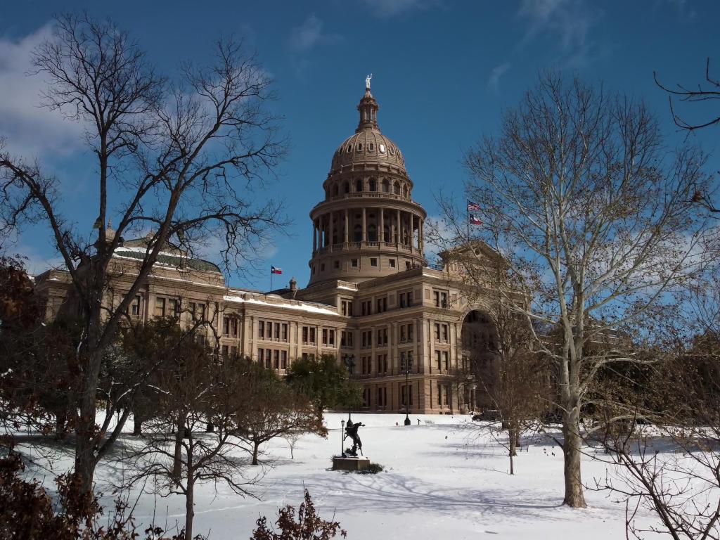 Fresh snow covering the Texas state capitol lawn after a winter storm in Austin