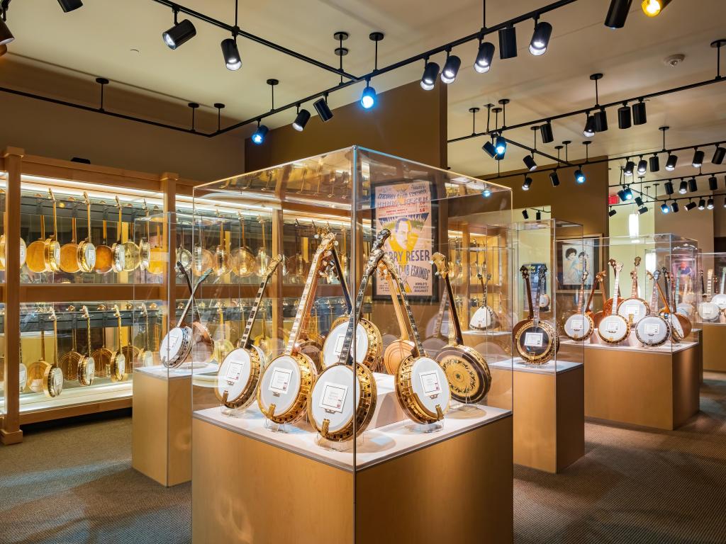 Dozens of banjos on display behind glass in the America Banjo Museum in Oklahoma City 