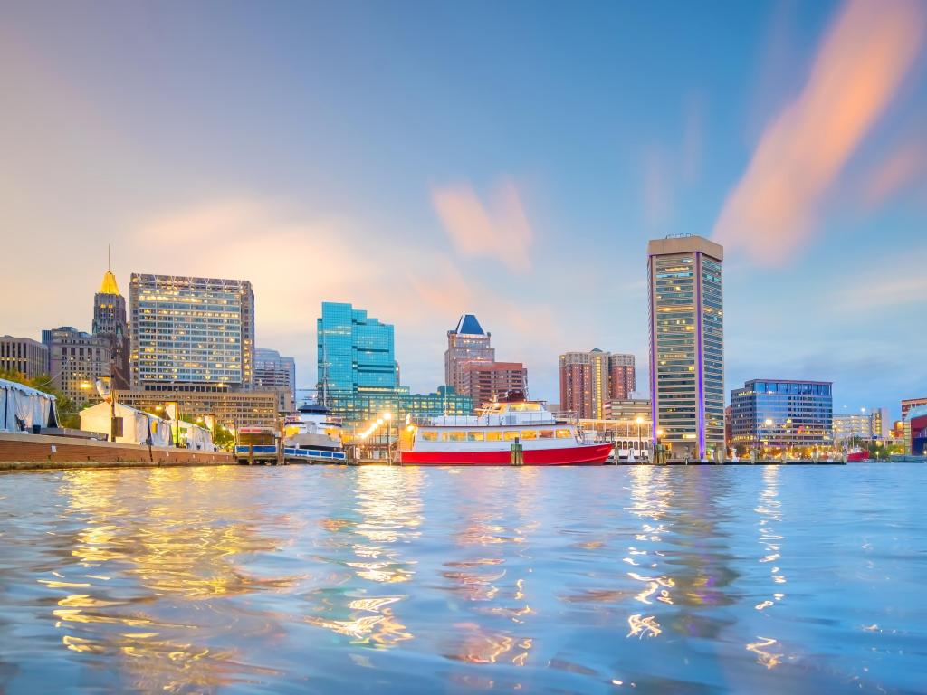 Baltimore, Maryland, USA with a view of the Inner Harbor area in downtown Baltimore at sunset.