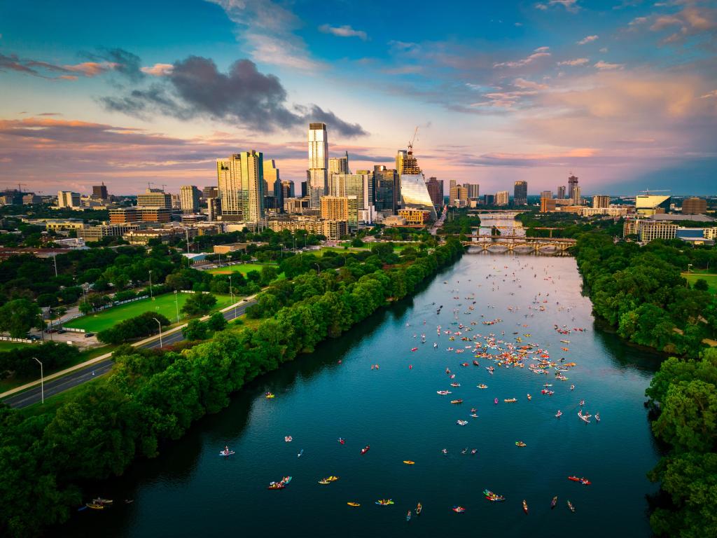 Colorful skyline at golden hour blue and pink clouds over Austin Texas USA Aerial Drone view above cityscape during gorgeous sunset