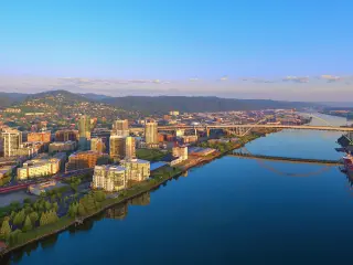 Aerial sunrise of the Fremont Bridge and the waterfront in downtown Portland Oregon on a sunny summer day