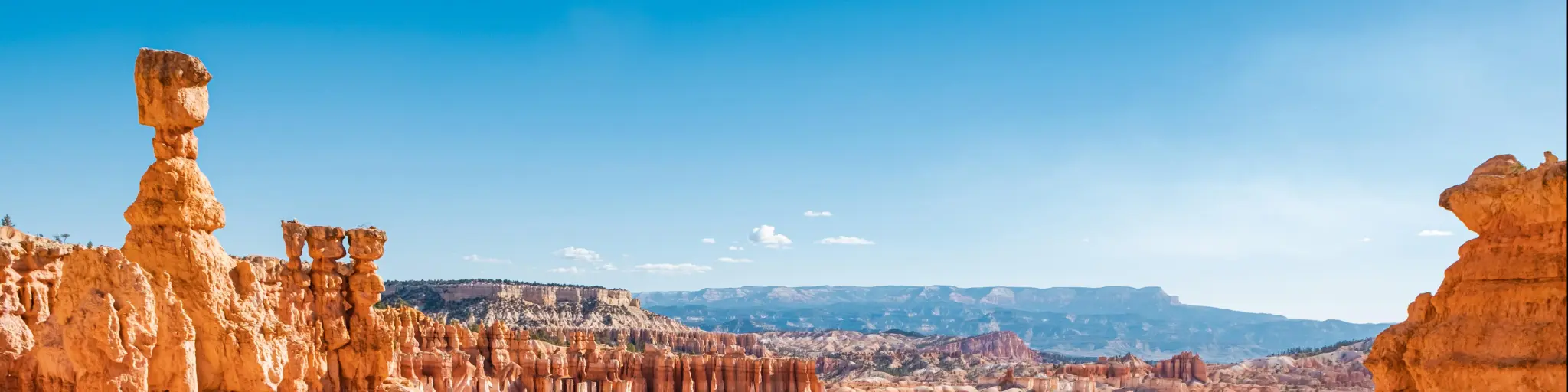 Bryce Canyon National Park, Utah on a crystal clear day with rugged red rock formations standing tall in the canyon