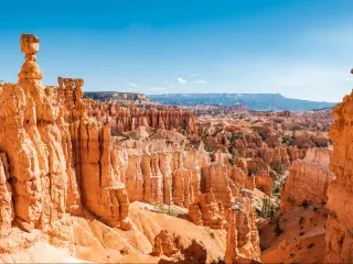 Bryce Canyon National Park, Utah on a crystal clear day with rugged red rock formations standing tall in the canyon
