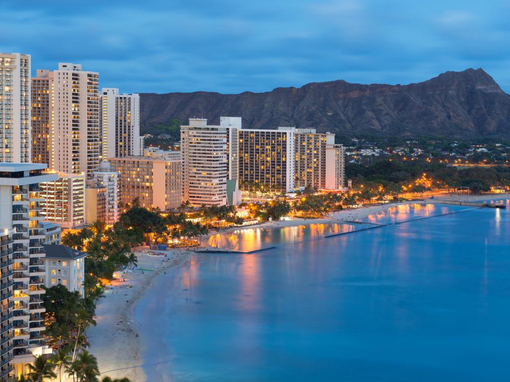 Scenic view of Honolulu city, Diamond Head and Waikiki Beach at night; Hawaii, USA.