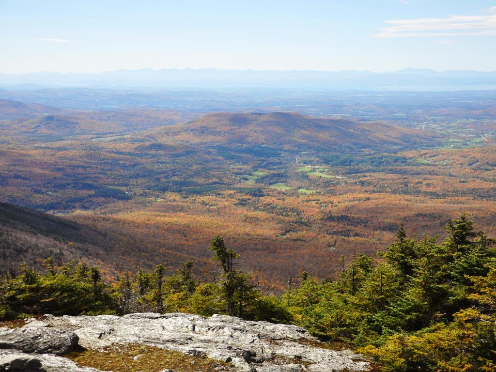 Aerial of Vermont Fall Foliage, Mount Mansfield, Vermont VT, USA on a sunny day.