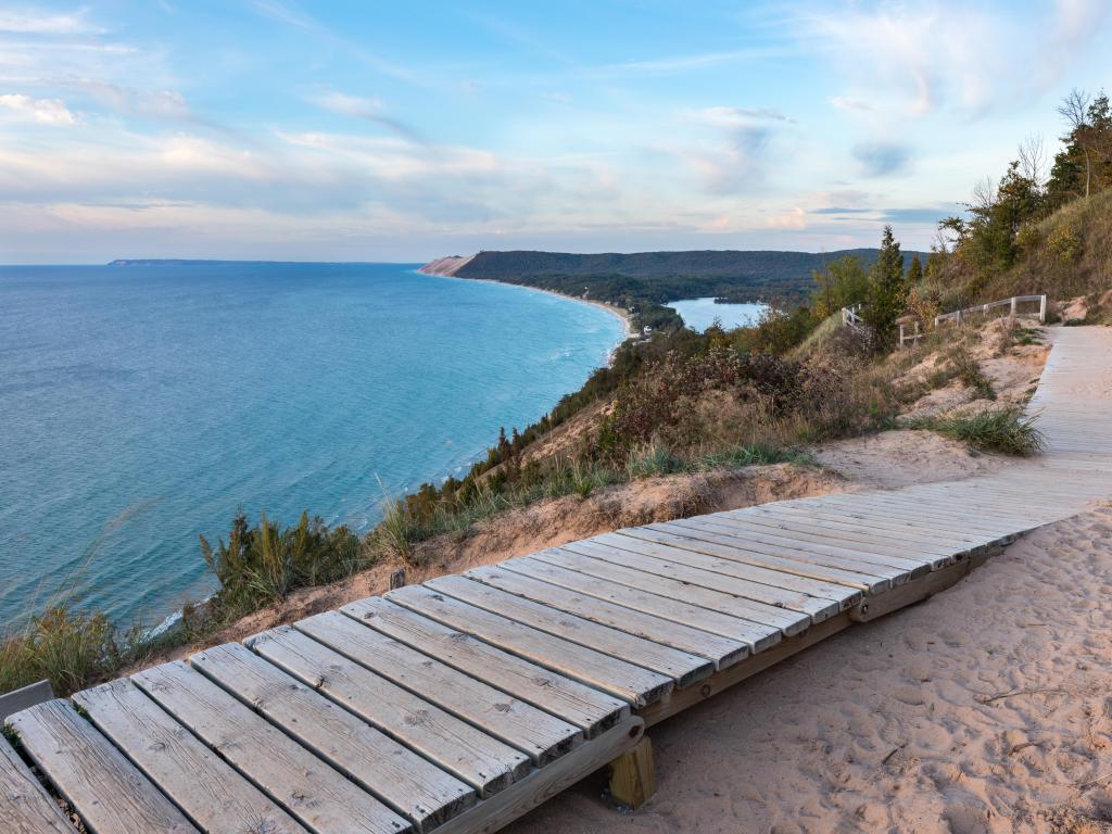 A weathered wooden walkway on the Empire Bluffs Trail is the perfect overlook to see Lake Michigan, the Sleeping Bear Dunes, and the Manitou island