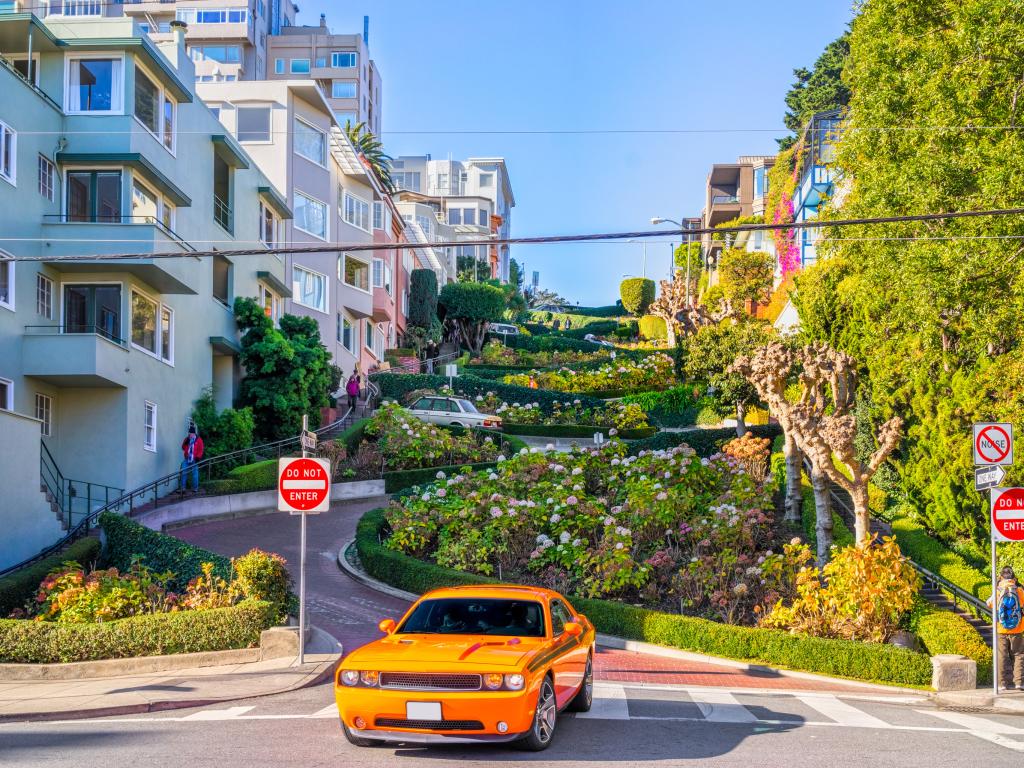 Car driving down the steep Lombard Street in San Francisco
