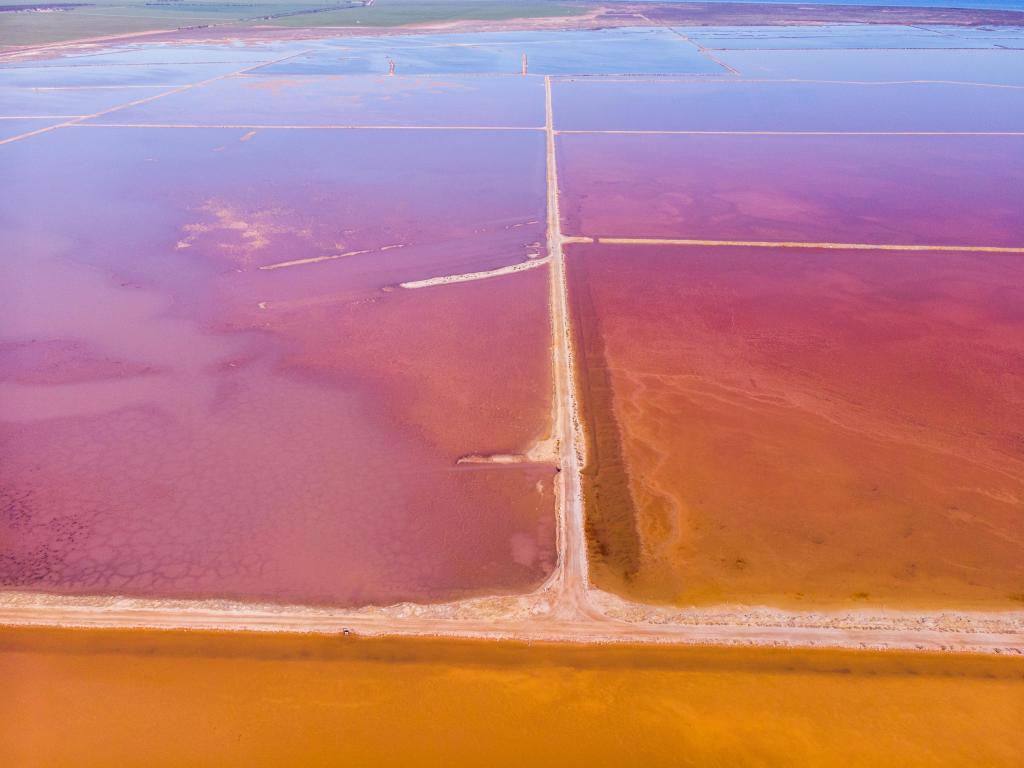 Lake Bumbunga, Australia taken as an aerial view of the salt lake in shades of pink and orange.