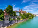 View of the Old Town of Basel with red stone Munster cathedral and the Rhine river, Switzerland.