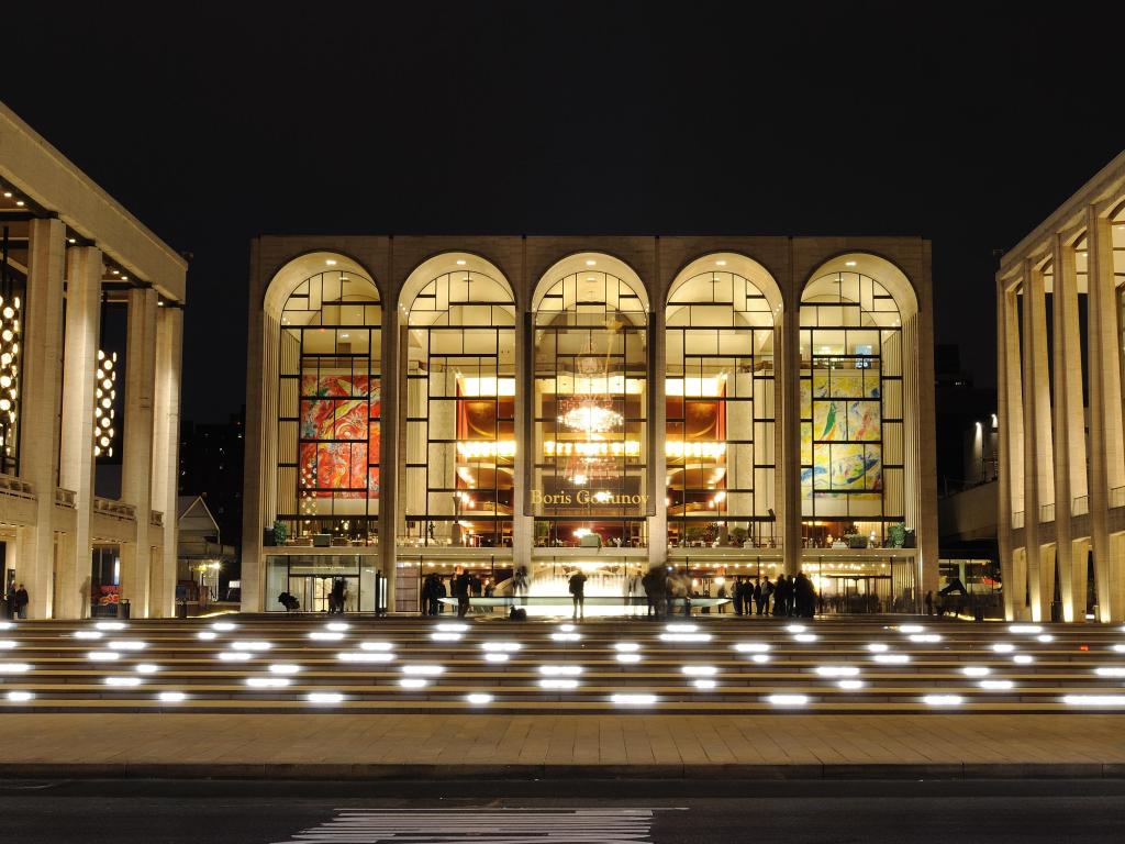 Evening view of the entrance to Metropolitan Opera House at Lincoln Center, with lit entrance and stairs