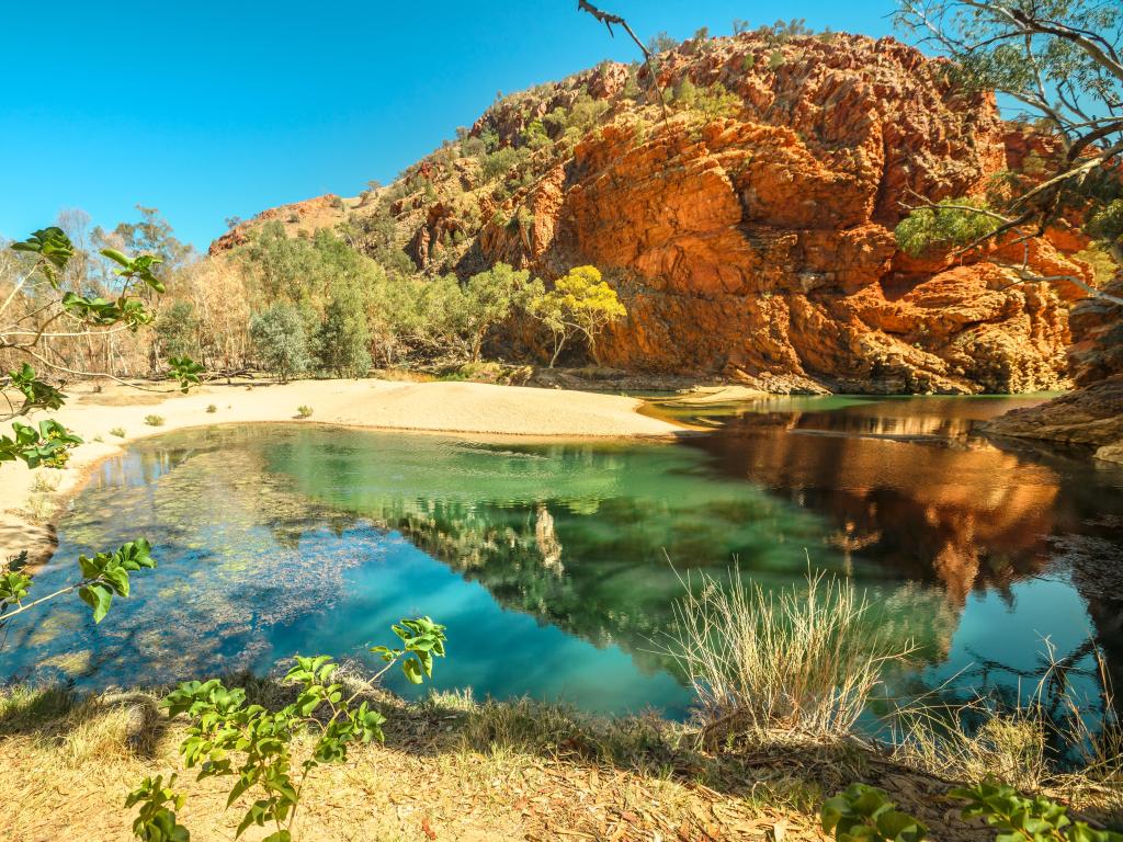 Ellery Creek Big Hole, part of Larapinta Trail with azure blue water and red rocks all around