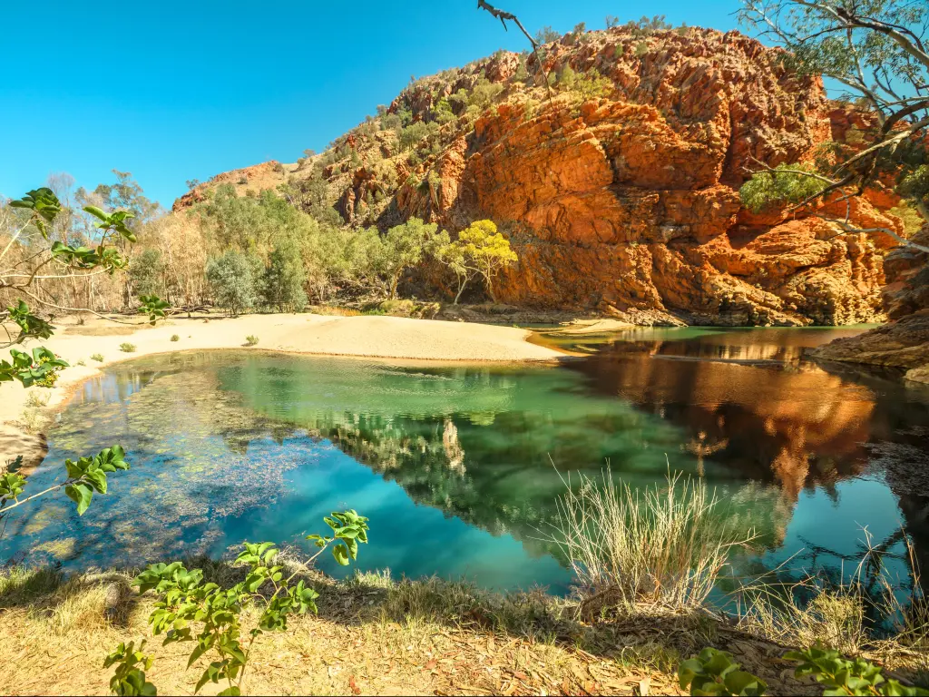 Ellery Creek Big Hole, part of Larapinta Trail with azure blue water and red rocks all around
