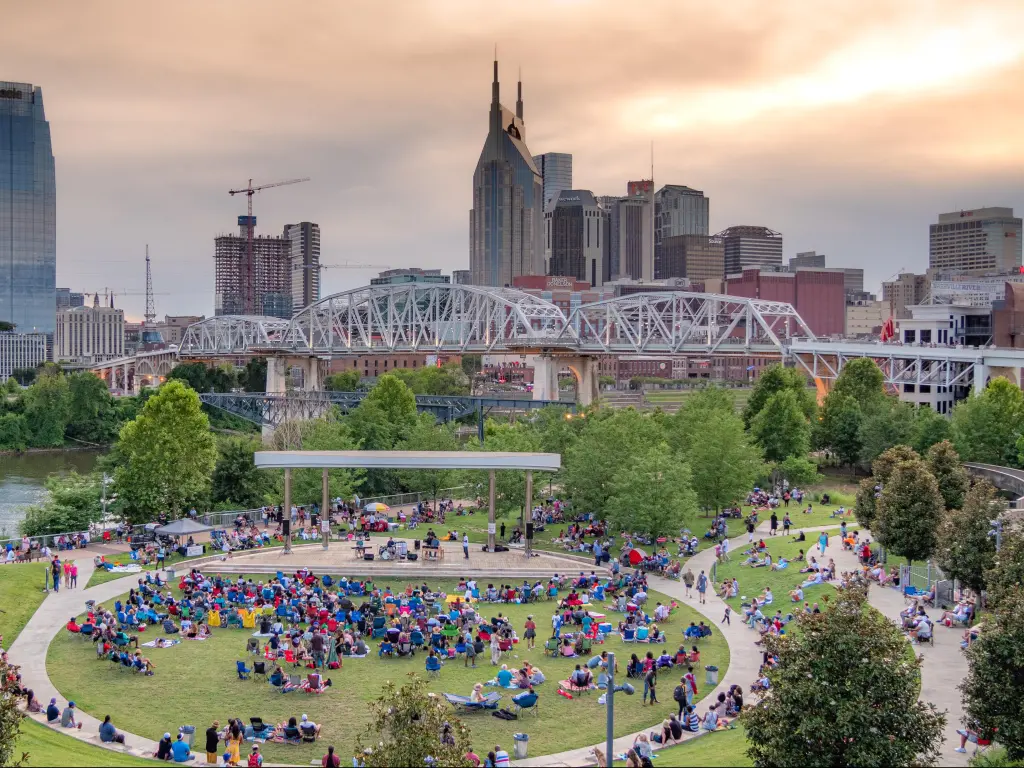 Crowds enjoy an open-air concert at Cumberland Park, Nashville in summer