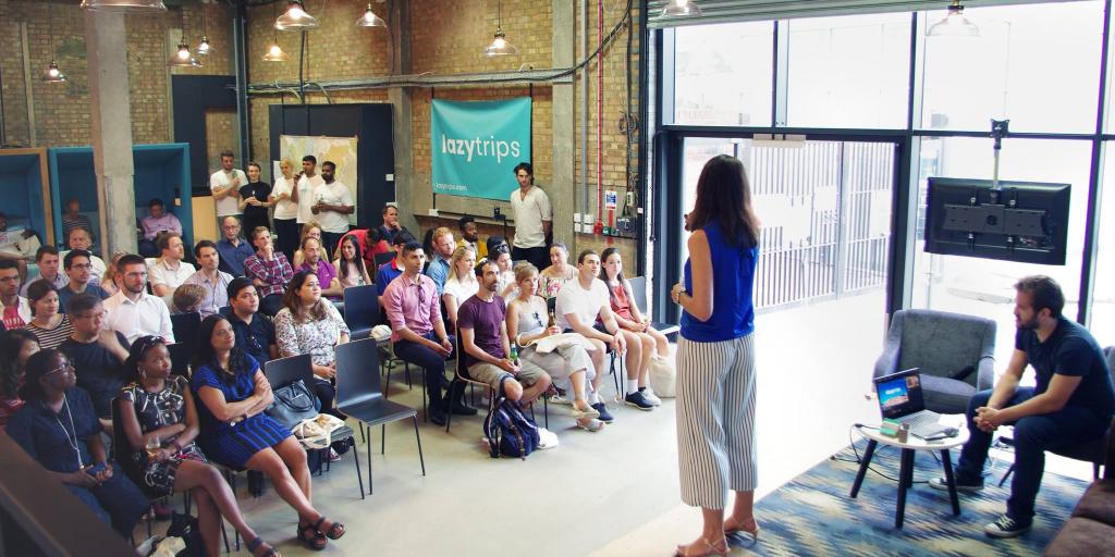 CCO Jen McNaught speaks on stage to an audience at the LazyTrips Launch