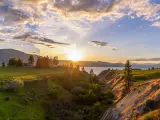 Okanagan Lake, Kelowna, British Columbia, Canada with a beautiful sunset over the vineyards of the Okanagan wine valleys and Okanagan Lake in the distance.