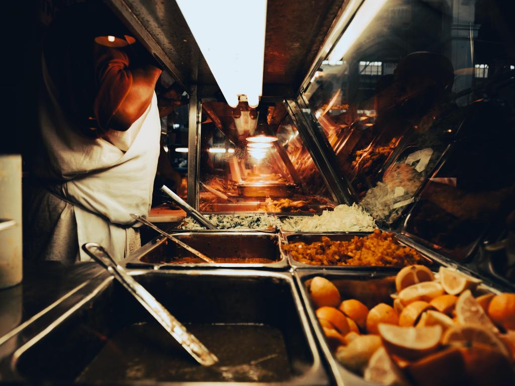 Serving dishes at a stall within Grand Central Market, Los Angeles