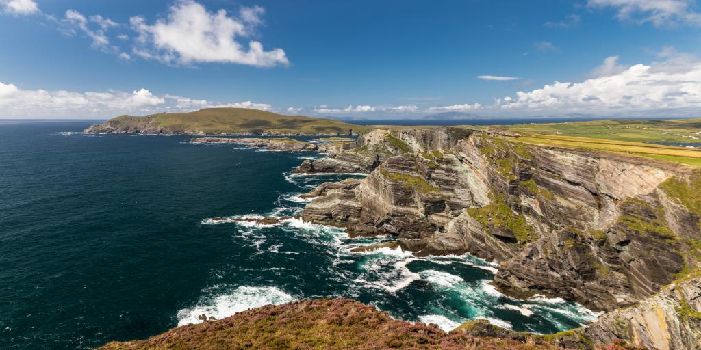 Waves crash against the spectacular cliffs along the Ring of Kerry in Ireland