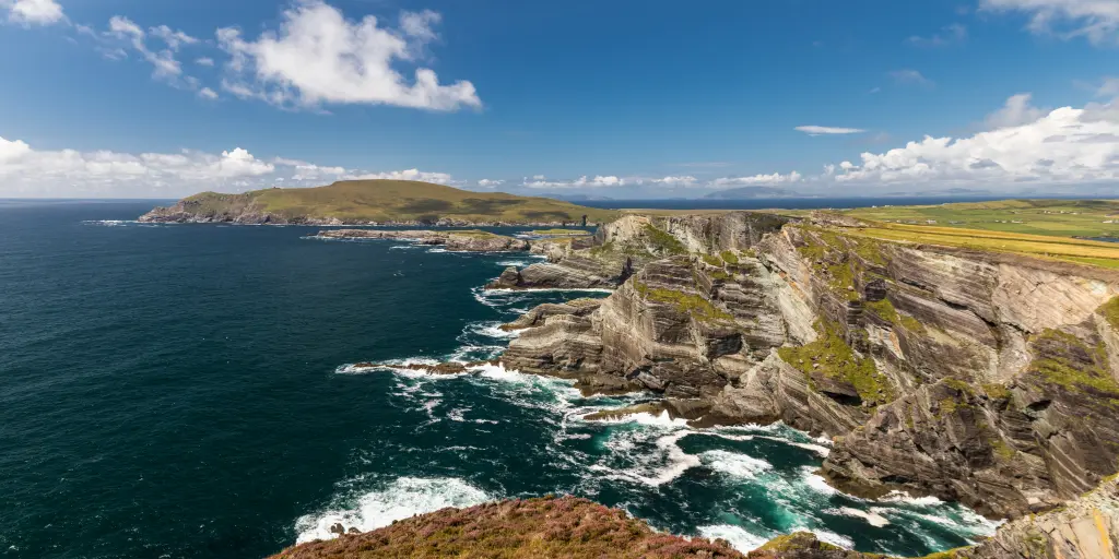 Waves crash against the spectacular cliffs along the Ring of Kerry in Ireland