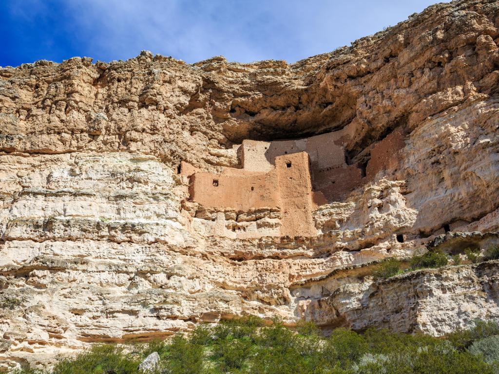 Montezuma Castle ancient ruins on a rock cliff on a sunny day