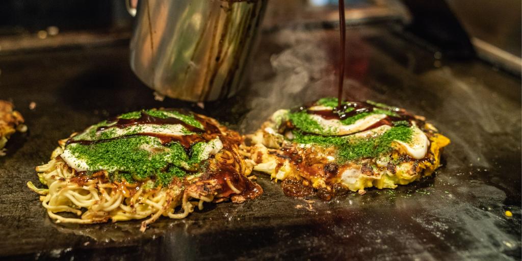 Okonomiyaki on a hot plate in Osaka 