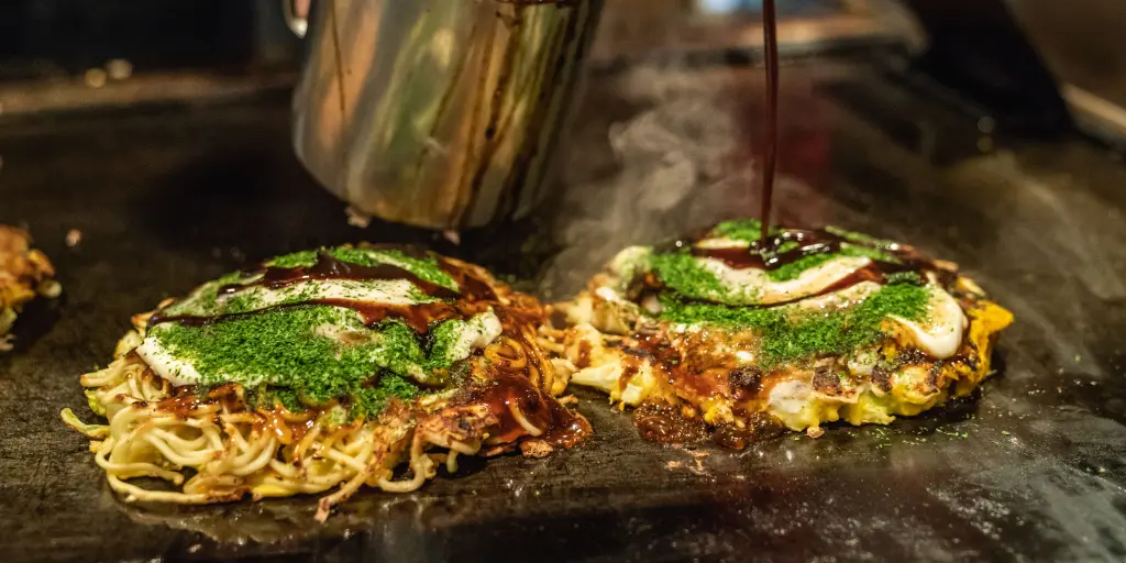 Okonomiyaki on a hot plate in Osaka 