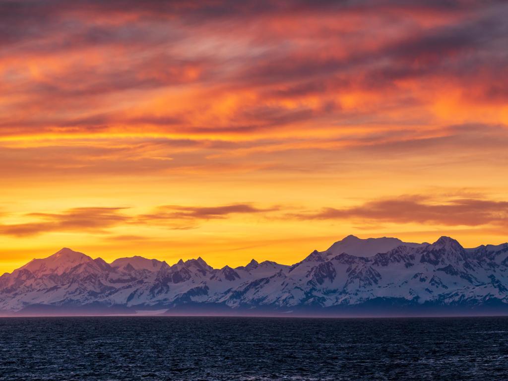 Panoramic view of sunset over Mount Fairweather by Glacier Bay National Park, Alaska