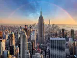 Full view of the Empire State Building with rainbow in the background