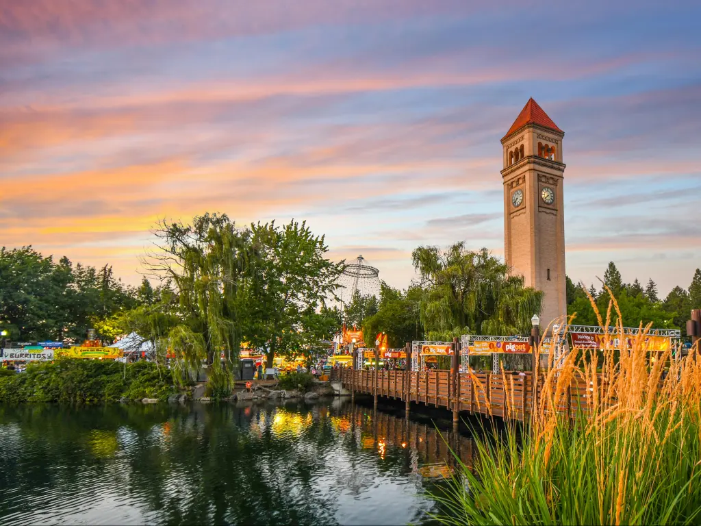 A colorful sunset cast over the Pig out in the Park at Riverfront Park along the Spokane River in Spokane, Washington