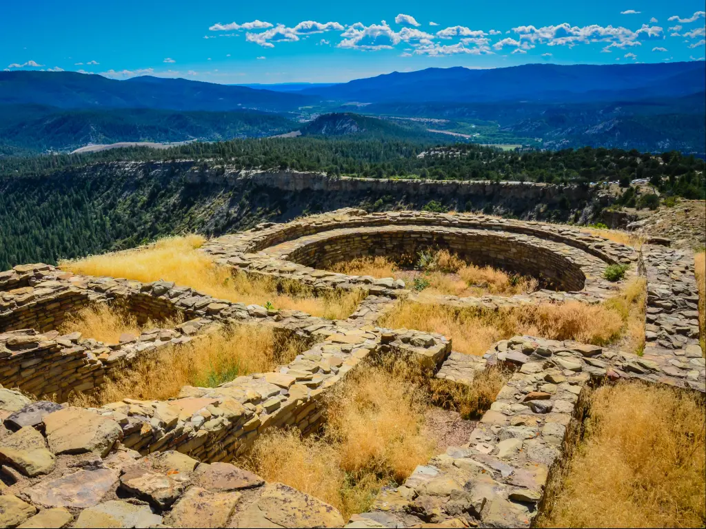 Ancient Ruins at Great Kiva, part of the Chimney Rock National Monument, with the expansive Chaco Canyon visible in the distance