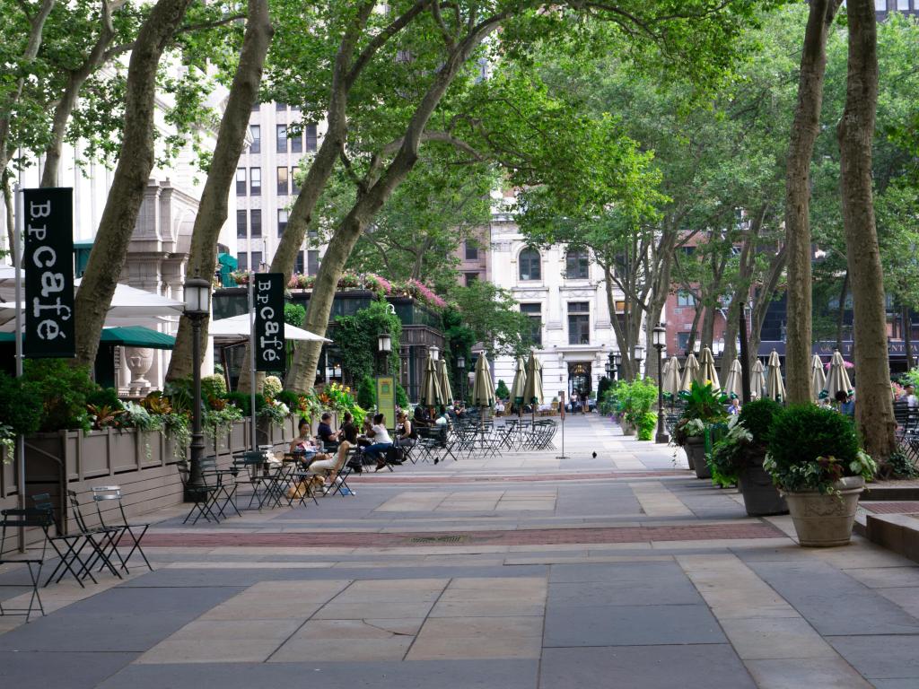 Cafes in Bryant Park, New York with customers sitting outside
