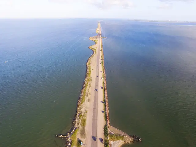 Famous man-made strip that sits straight on the ocean on a sunny day