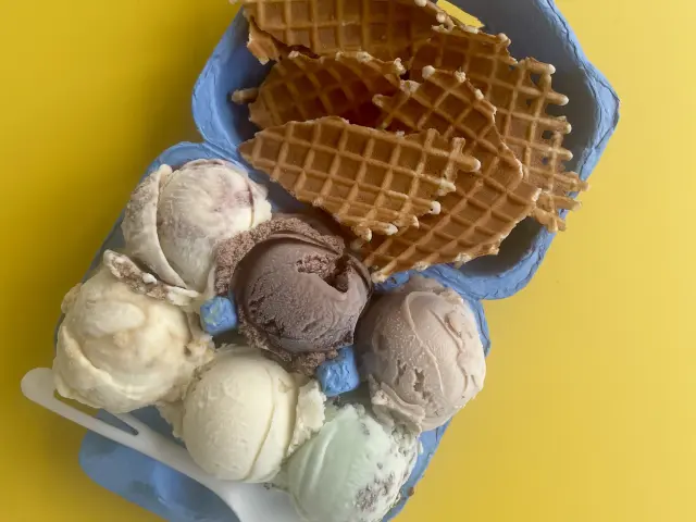 Super Secret Ice Cream's signature 'flight' of ice cream scoops, served in an egg box with pieces of waffle cone on the side