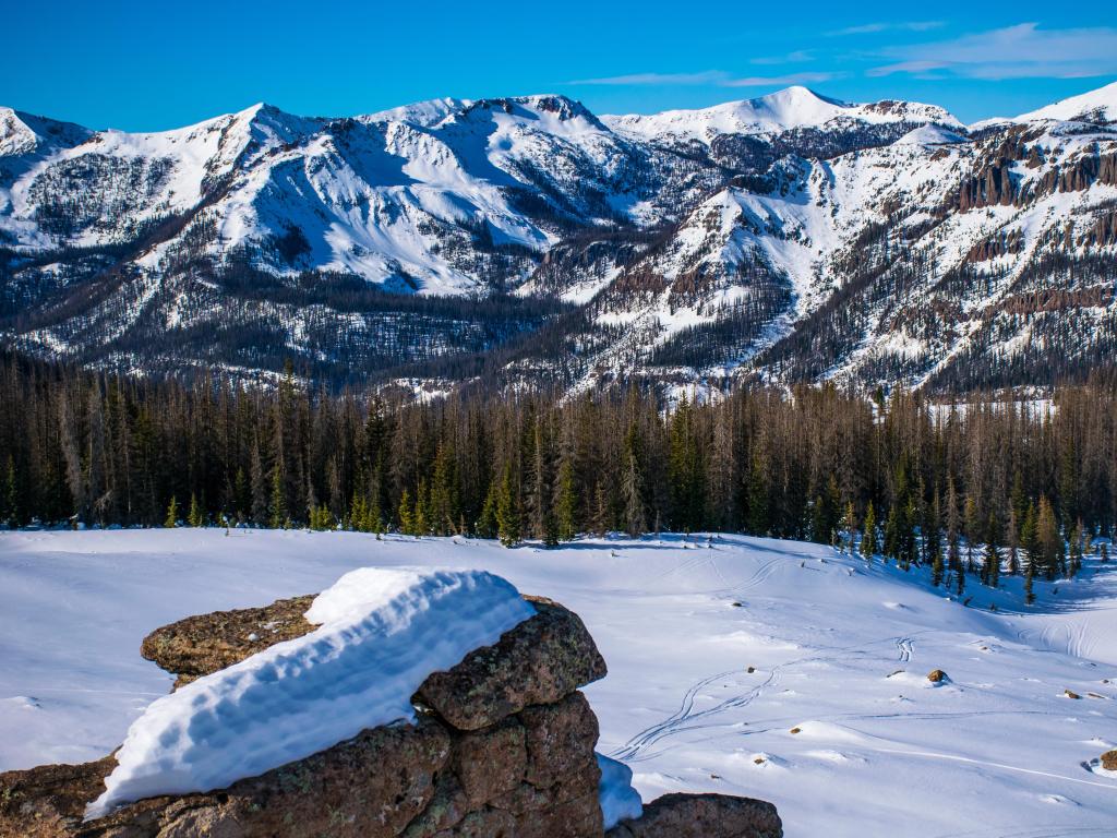 A tranquil winter landscape high up in the snow-capped Rocky Mountains, showcasing the serene beauty of Wolf Creek, Colorado.