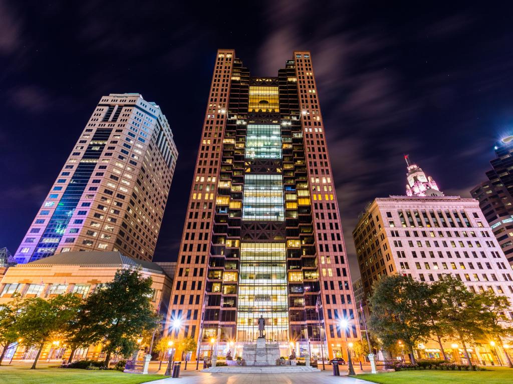 Lights beaming around The Statehouse in Capitol Square Columbus, Ohio in the evening