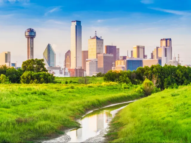 View of downtown Dallas with open green space surrounding it