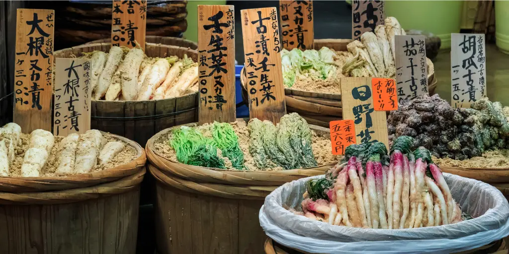 Vegetables on sale in baskets at  Nishiki Market, Kyoto