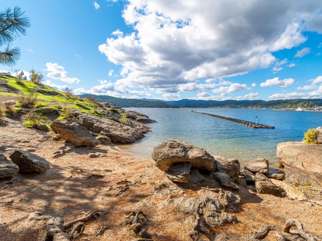 View from the lower hiking trail on Tubbs Hill reserve of the lake and mountains near downtown in the rural resort city of Coeur d'Alene, Idaho, USA.