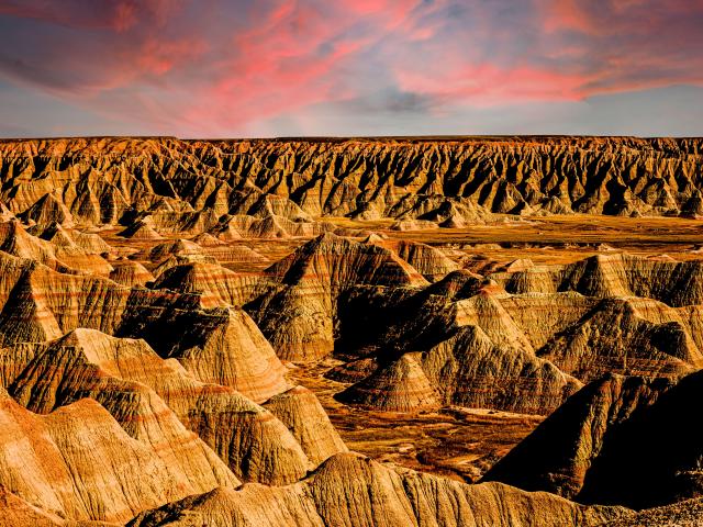 Unique sand-colored rock formations in the national park during a dramatic sunset